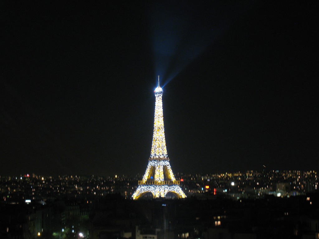IMG_5844.JPG - Glittering Eiffel Tower ( http://en.wikipedia.org/wiki/Eiffel_Tower ) from the roof of the Arc de Triomphe ( http://en.wikipedia.org/wiki/Arc_de_Triomphe )