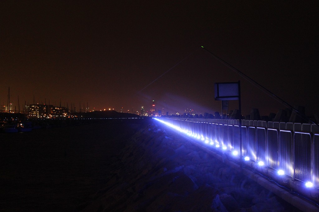 IMG_8263.JPG - Tel Aviv  http://en.wikipedia.org/wiki/Tel_Aviv  coast line from Herzliya  http://en.wikipedia.org/wiki/Herzliya,_Israel  at night. The breakwater/lights seem directly lead to the Reading Power Station  http://en.wikipedia.org/wiki/Reading_Power_Station  chimney.