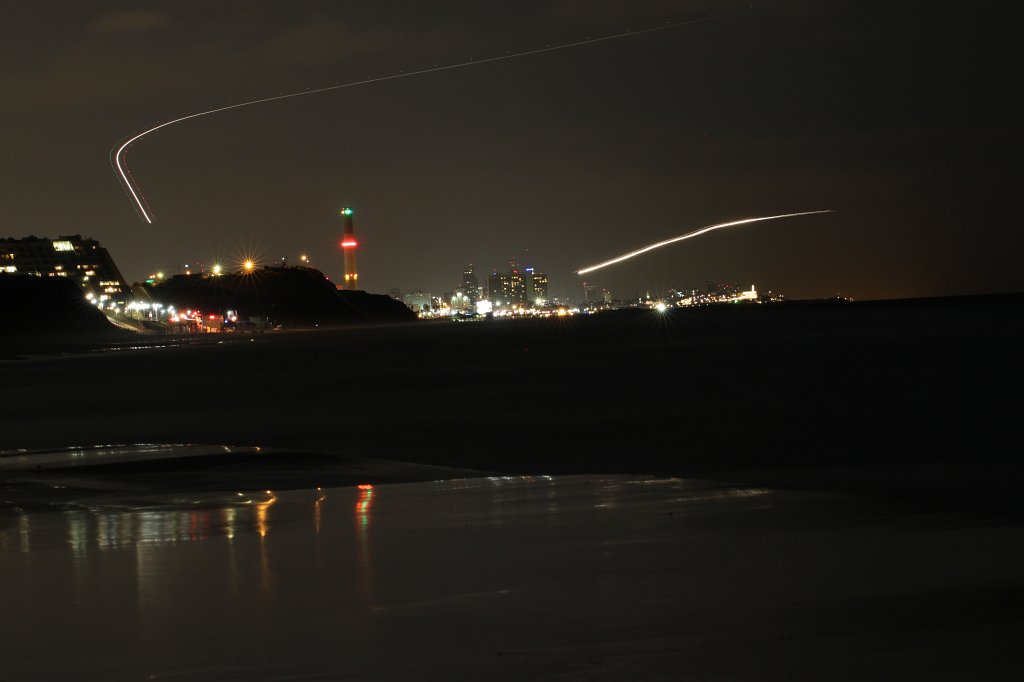 IMG_5301.JPG -  Tel Aviv  from the  Herzliya marina  beach. The chimney belongs to  Reading Power Station . Planes left a traces in the sky.