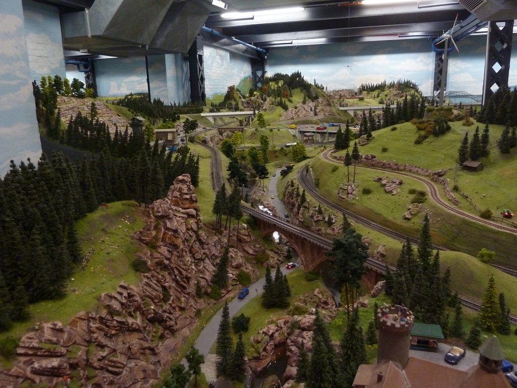 P1050479.JPG - Landscape in the  Miniatur Wunderland  ( miniature wonderland ). The world largest miniature railway not only host trains but also running cars, trucks, ship and even "flying" airplanes.