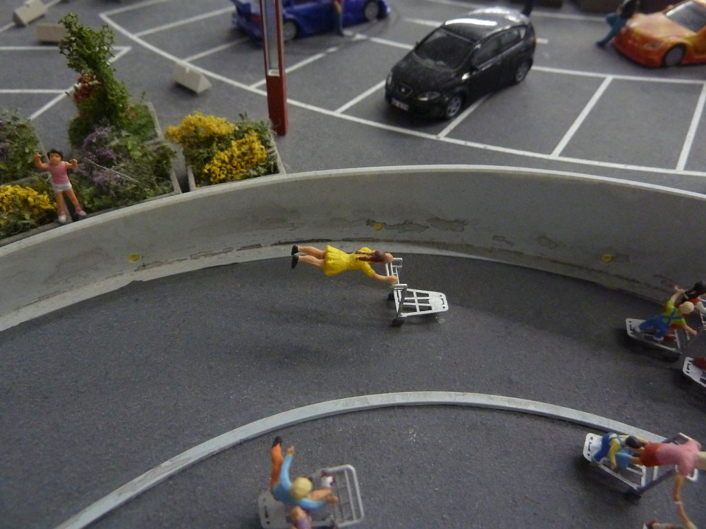 P1050491.JPG - Racing fun in the  Miniatur Wunderland  ( miniature wonderland ). The world largest miniature railway not only host trains but also running cars, trucks, ship and even "flying" airplanes.